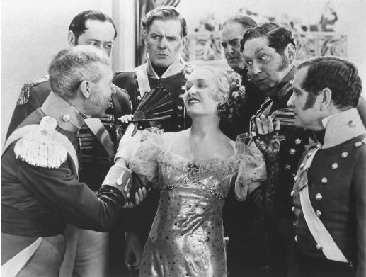 Miriam Hopkins enjoys the attention of several admirers.