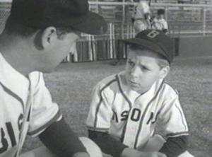 Billy Chapin (right) tells Lloyd Bridges what's wrong with his swing.