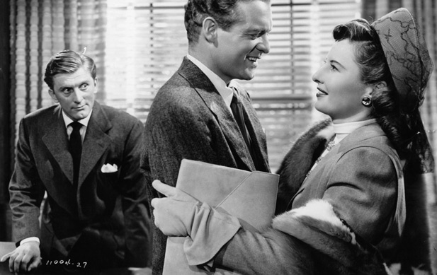 Barbara Stanwyck is waaay too happy to see Van Heflin (right). Image: Biography