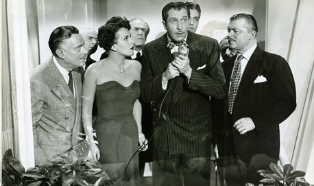 Vincent Price (centre, clutching heart) is surrounded by his Yes People. Image: ldsjf eiofj