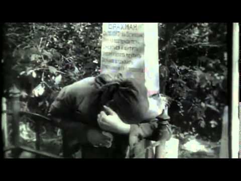 A woman weeps at a grave site. Image: lsdkjf alksdfj sdjkf