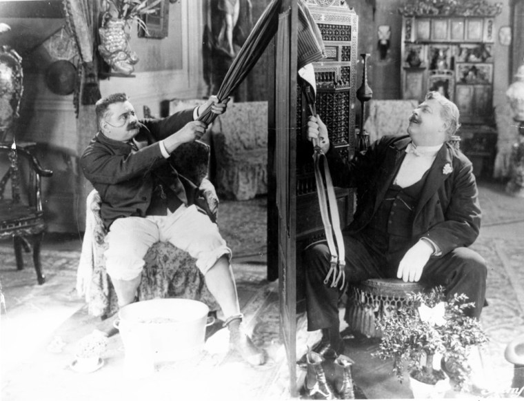 A trousers tug o' war. Image: Silent London