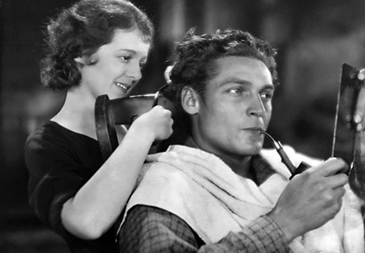 Janet Gaynor cuts ___ hair. Image: