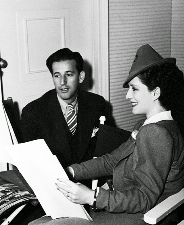Norma Shearer discusses costume design with Adrian for The Women (1939). Image: Vintage Everyday